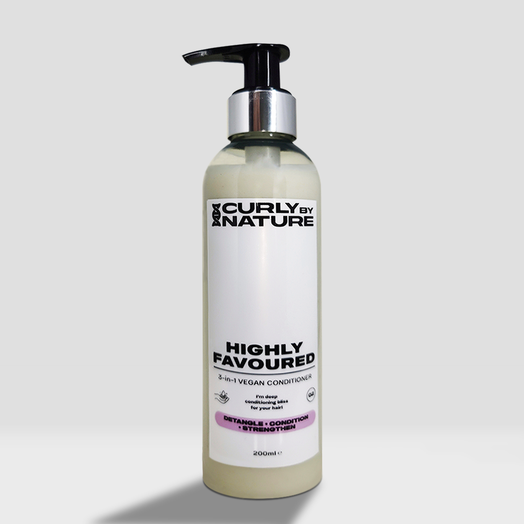 A bottle of HIGHLY FAVOURED conditioner by Curly by Nature, which is a vegan conditioner designed for curly hair.